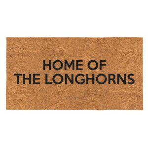 A brown door mat with the words " home of the longhorns ".