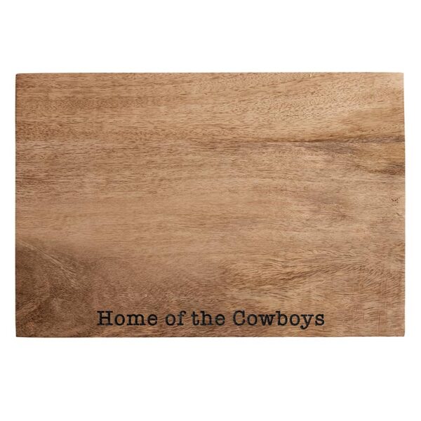 A cutting board that says home of the cowboys.