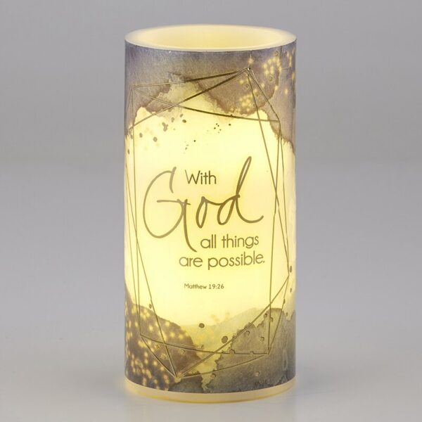 A candle that has the words " with god all things are possible ".