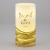 A candle that has the words " be still and know."