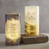 Two candles with gold foil on them