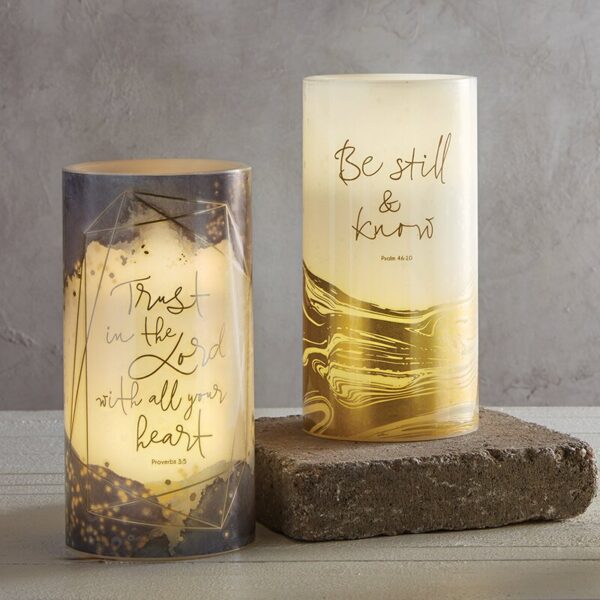 Two candles with gold foil on them