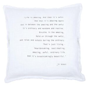 A white pillow with a poem written in black.