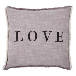 A pillow with the word love written on it.