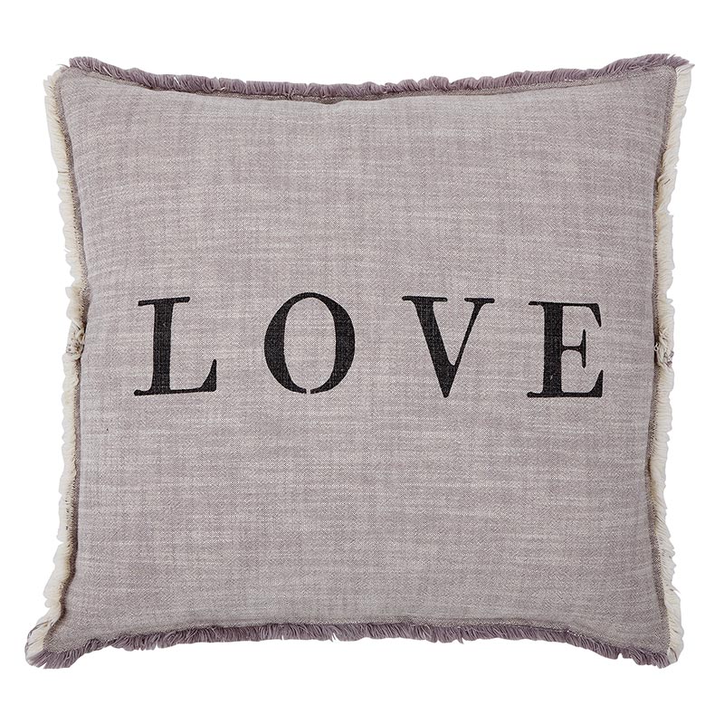 A pillow with the word love written on it.