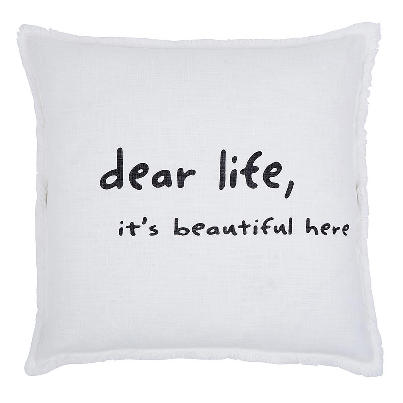 A pillow with the words " dear life, it's beautiful here ".