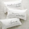 Three pillows with a quote written on them.
