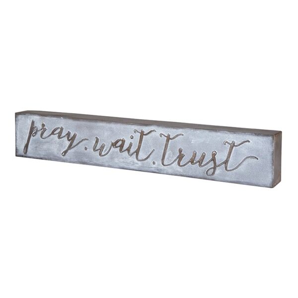 A sign that says pray wait trust