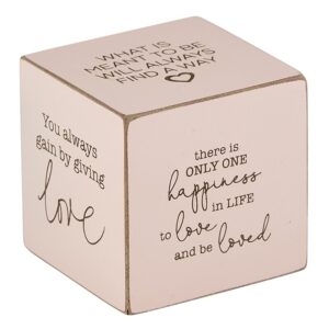 A cube with the words " there is only one happiness in life and to love and to god ".