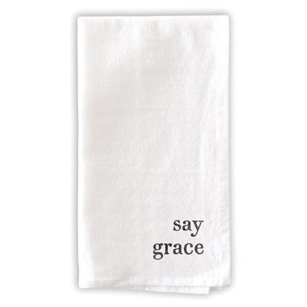 A white towel with the words " say grace ".