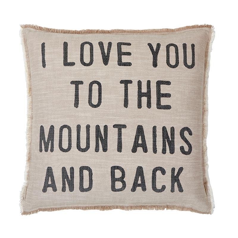 A pillow that says i love you to the mountains and back.