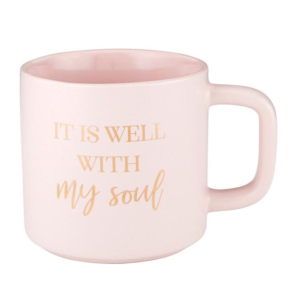 A pink coffee mug with the words it is well with my soul written on it.