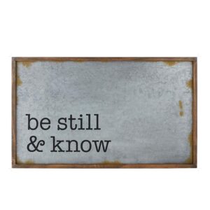 A sign that says be still and know