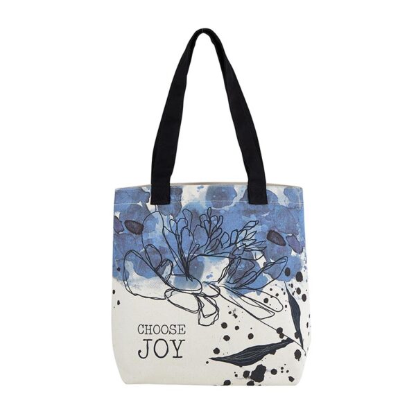 A white bag with blue flowers and black handles.