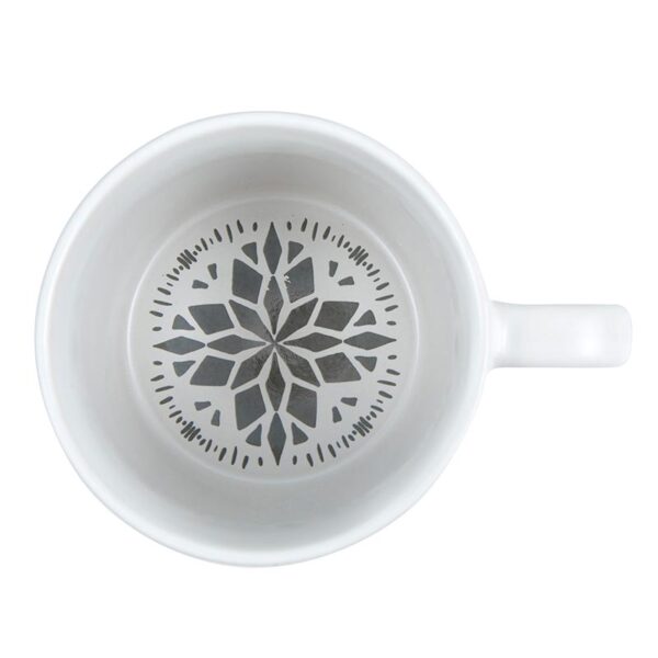 A white mug with a black snowflake design on it.