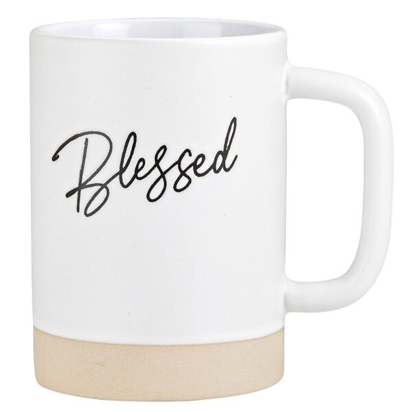 A coffee mug with the word blessed written on it.