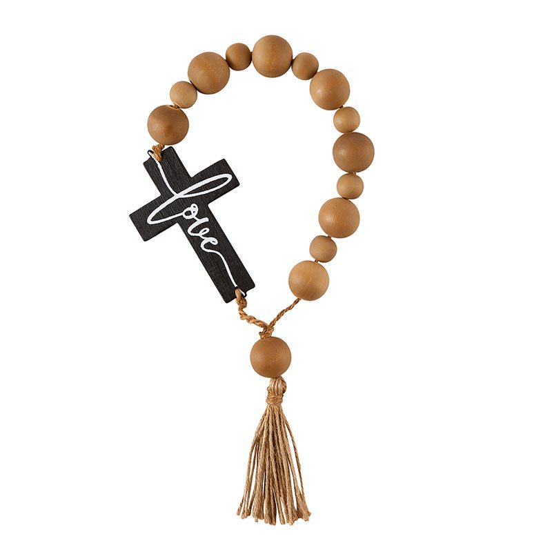 A wooden rosary with a cross on it.