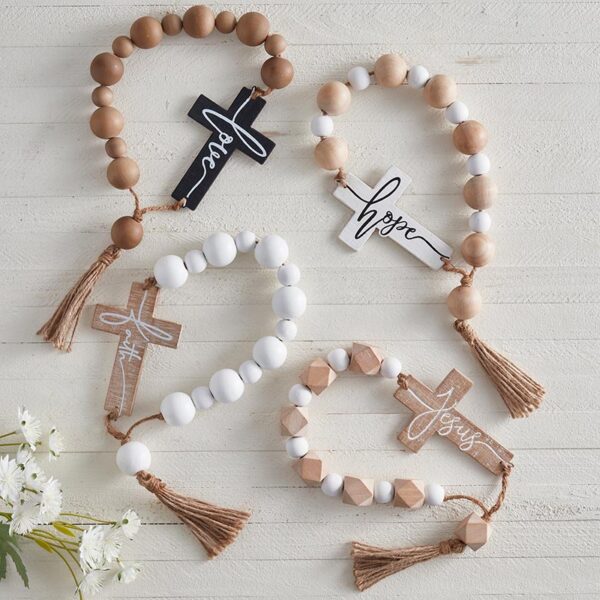 A group of wooden beads with crosses on them.