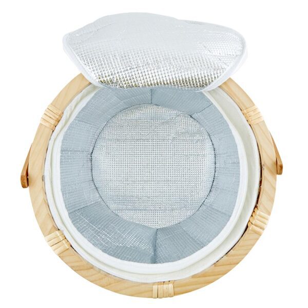 A round wooden basket with a white lid.