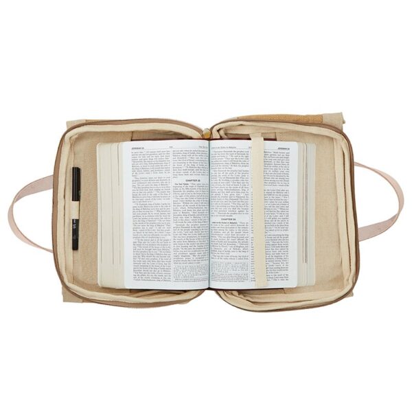 A bible is open to the pages of an old testament.