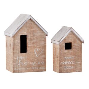 A set of two wooden houses with white writing on them.