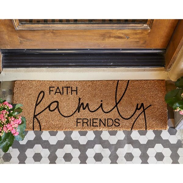 A door mat that says " faith family friends ".