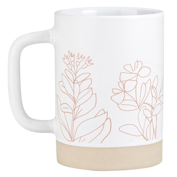 A mug with some flowers on it