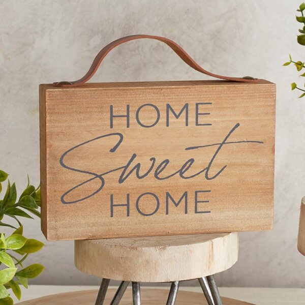 A wooden sign that says home sweet home.