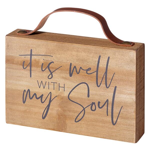 A wooden sign that says it is well with my soul.