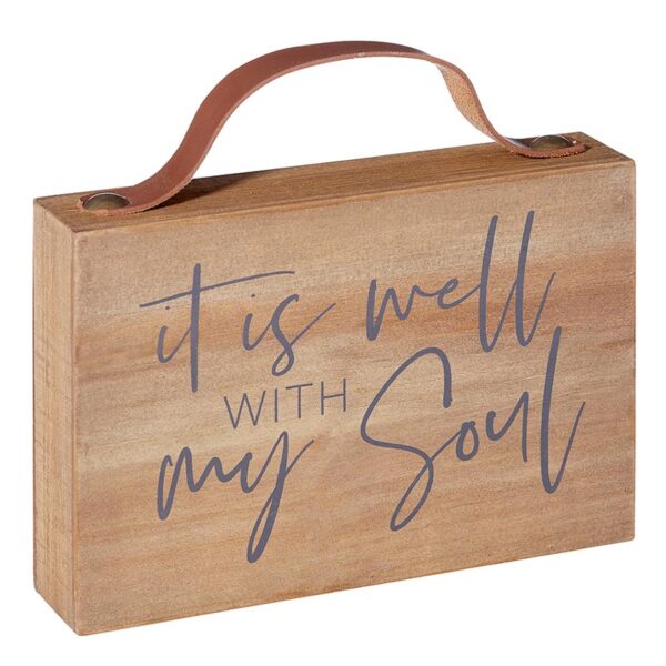 A wooden box with the words it is well with my soul written on it.