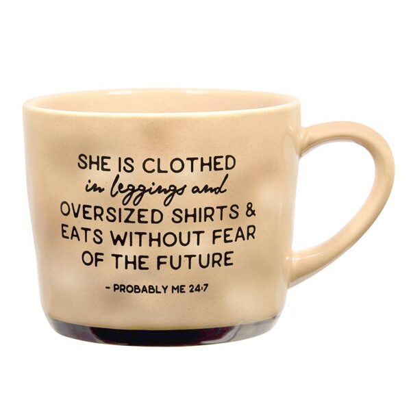 A coffee mug with the words " she is clothed in leggings and oversized shirts & eats without fear of the future ".